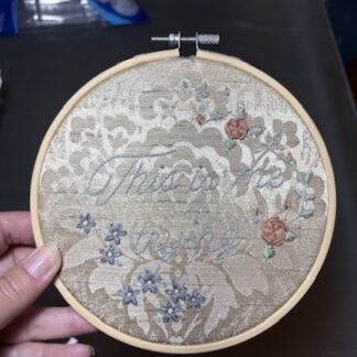 6" Embroidery hoop art "this is me trying" on gold brocade with pink roses and blue daisies