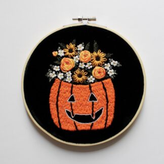 glow in the dark embroidered pumpkin and floral 6” embroidery hoop, hand stitched spooky cute home decor, black velvet wall art, Halloween decor