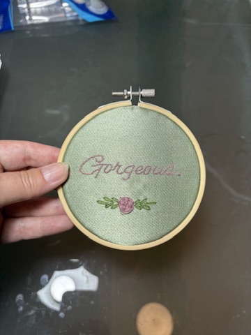4" Embroidered Hoop Art "gorgeous" on green satin in pink with pink rose
